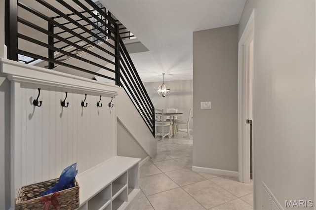 6620 Lake Point Dr Unit 26, Osage Beach, MO 65065 - mudroom with light tile patterned floors and a chandelier