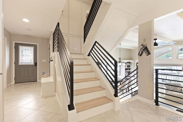 6620 Lake Point Dr Unit 26, Osage Beach, MO 65065 - staircase featuring tile patterned floors, a ceiling fan, and recessed lighting