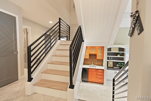 6620 Lake Point Dr Unit 26, Osage Beach, MO 65065 - staircase featuring tile patterned floors, recessed lighting, and wet bar