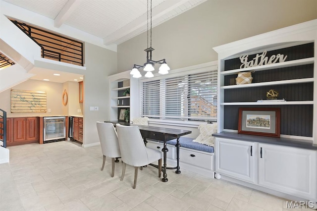 6620 Lake Point Dr Unit 26, Osage Beach, MO 65065 - dining room featuring wine cooler, a high ceiling, beam ceiling, a chandelier, and a dry bar
