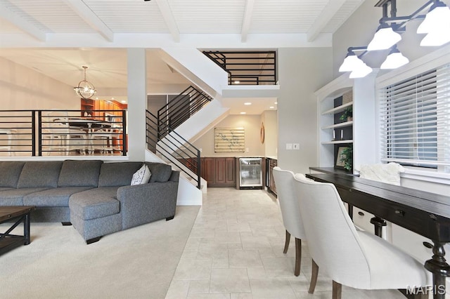 6620 Lake Point Dr Unit 26, Osage Beach, MO 65065 - living area with a chandelier, beverage cooler, beamed ceiling, stairway, and built in features