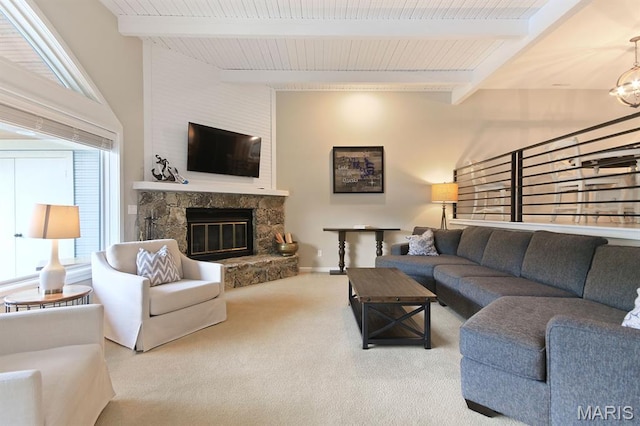 6620 Lake Point Dr Unit 26, Osage Beach, MO 65065 - carpeted living room with a stone fireplace and a wooden ceiling with exposed beams