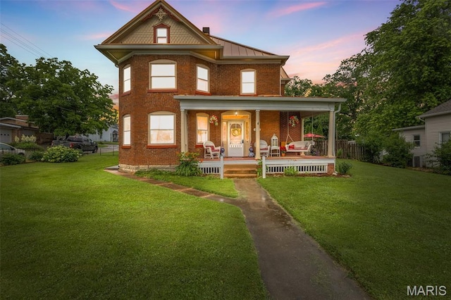 698N 3rd St, Saint Genevieve, MO 63670 - victorian home featuring a porch and brick siding