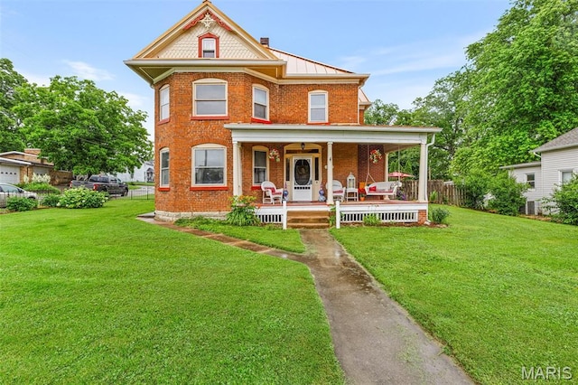698N 3rd St, Saint Genevieve, MO 63670 - victorian-style house with brick siding and a porch