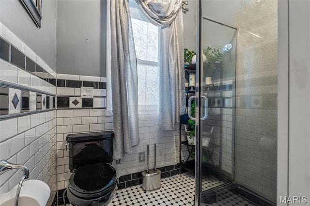 698N 3rd St, Saint Genevieve, MO 63670 - bathroom with tile walls, tile patterned flooring, and a shower stall