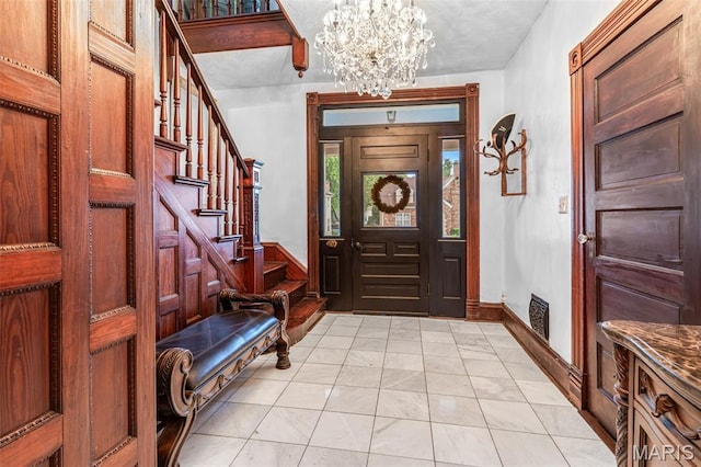 698N 3rd St, Saint Genevieve, MO 63670 - foyer entrance with a chandelier, light marble finish floors, and stairs