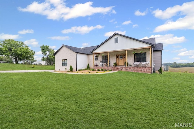 8353 Maple Grove Rd, Troy, IL 62294 - view of front of property with covered porch and a front yard