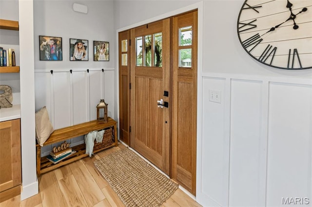 8353 Maple Grove Rd, Troy, IL 62294 - entryway with a decorative wall, a wainscoted wall, and light wood-style floors