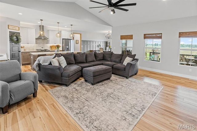 8353 Maple Grove Rd, Troy, IL 62294 - living room featuring ceiling fan, a chandelier, light wood-type flooring, lofted ceiling, and recessed lighting