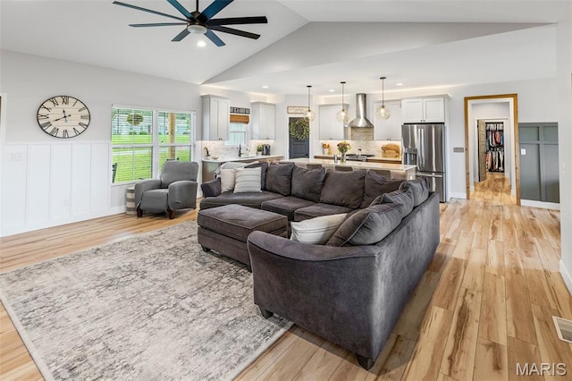 8353 Maple Grove Rd, Troy, IL 62294 - living area featuring light wood-style floors, ceiling fan, vaulted ceiling, recessed lighting, and a wainscoted wall