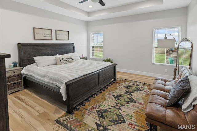 8353 Maple Grove Rd, Troy, IL 62294 - bedroom featuring a tray ceiling, light wood-type flooring, recessed lighting, and ceiling fan