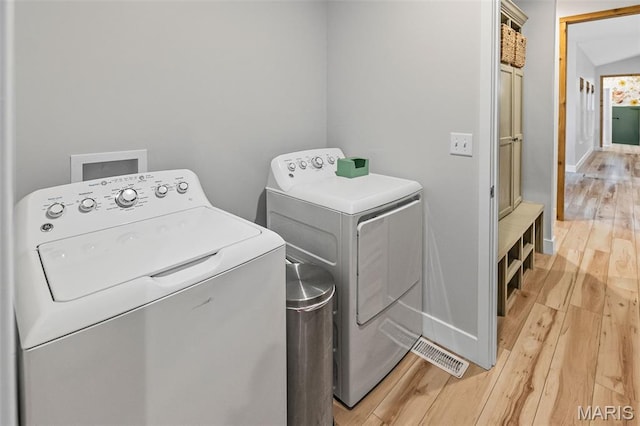 8353 Maple Grove Rd, Troy, IL 62294 - washroom with separate washer and dryer and light wood-type flooring