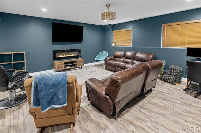 8353 Maple Grove Rd, Troy, IL 62294 - living room featuring wood finished floors, recessed lighting, and a glass covered fireplace
