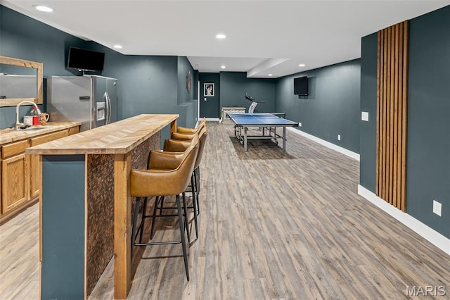 8353 Maple Grove Rd, Troy, IL 62294 - playroom featuring light wood-style floors, wet bar, and recessed lighting