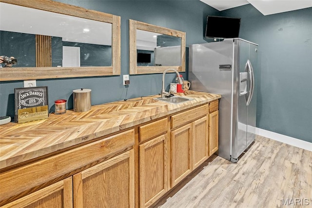 8353 Maple Grove Rd, Troy, IL 62294 - kitchen featuring stainless steel refrigerator with ice dispenser, wood counters, and light wood-type flooring