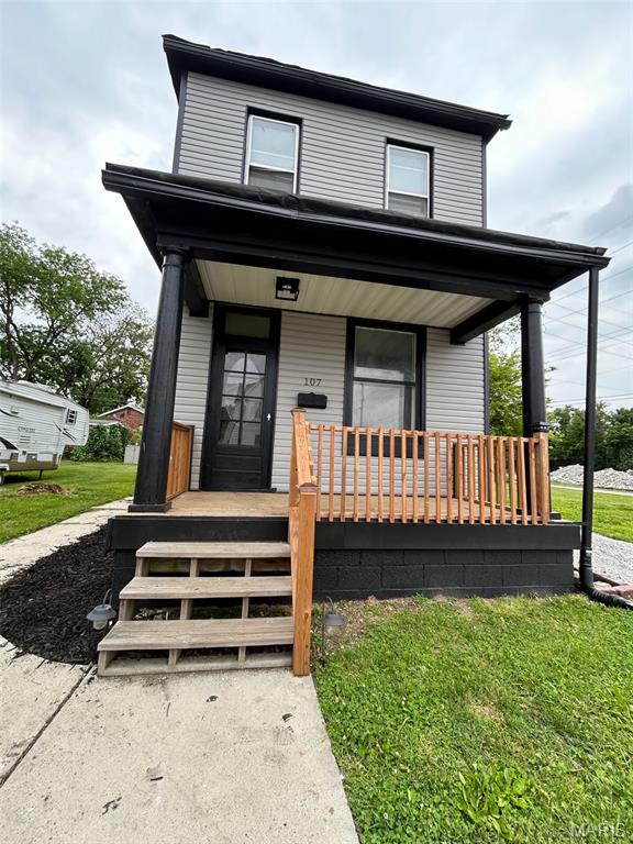 107 N 18th St, Belleville, IL 62226 - view of front of home with a porch and a front yard