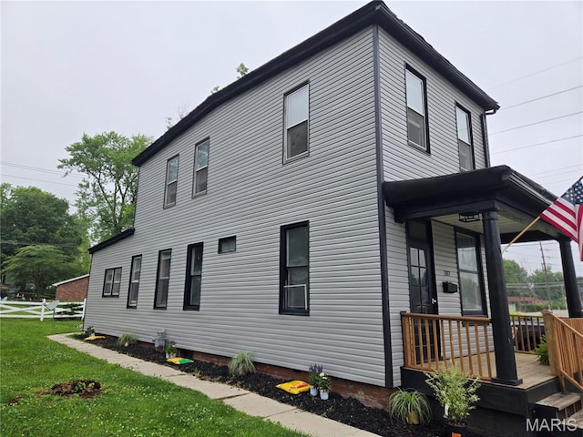 107 N 18th St, Belleville, IL 62226 - view of home's exterior featuring a lawn