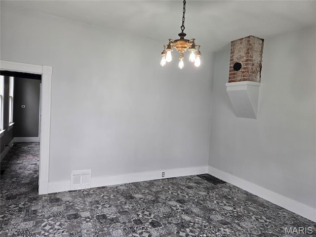 107 N 18th St, Belleville, IL 62226 - spare room with a chandelier and baseboards