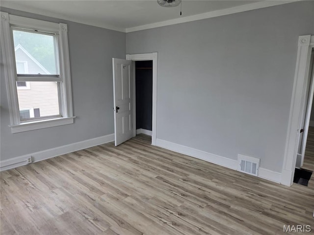 107 N 18th St, Belleville, IL 62226 - unfurnished room with wood finished floors, baseboards, and ornamental molding