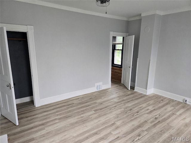 107 N 18th St, Belleville, IL 62226 - unfurnished room featuring baseboards, light wood-style floors, and ornamental molding