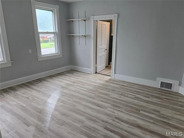 107 N 18th St, Belleville, IL 62226 - unfurnished bedroom with light wood-type flooring and baseboards