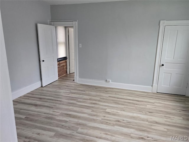 107 N 18th St, Belleville, IL 62226 - spare room featuring light wood-type flooring and baseboards