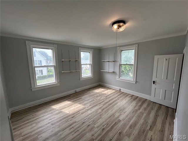 107 N 18th St, Belleville, IL 62226 - empty room featuring crown molding, wood finished floors, and baseboards