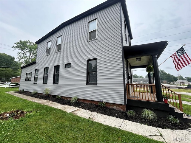 107 N 18th St, Belleville, IL 62226 - view of side of property with a yard and a porch