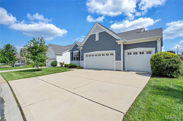 803 Brimley Dr, Cottleville, MO 63304 - view of front of home with a garage, driveway, a front lawn, and roof with shingles