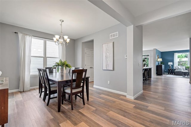 803 Brimley Dr, Cottleville, MO 63304 - dining room with a chandelier and wood finished floors