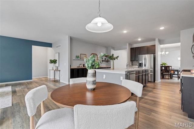 803 Brimley Dr, Cottleville, MO 63304 - dining room featuring light wood-style floors, recessed lighting, and a chandelier