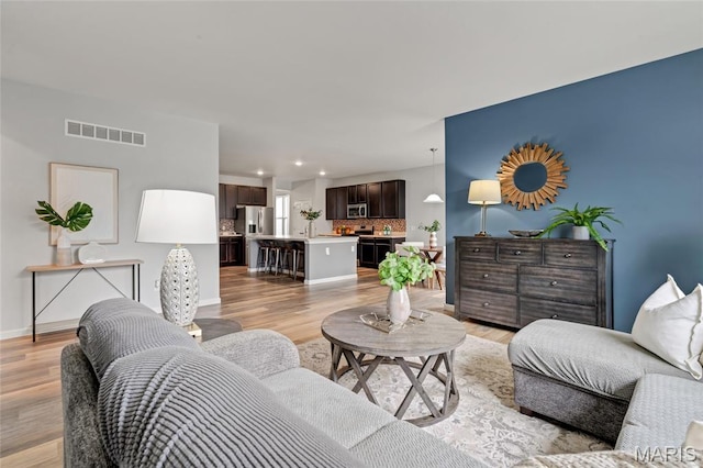803 Brimley Dr, Cottleville, MO 63304 - living room with light wood finished floors and recessed lighting