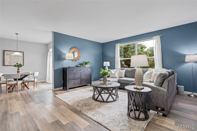 803 Brimley Dr, Cottleville, MO 63304 - living room featuring wood finished floors and baseboards