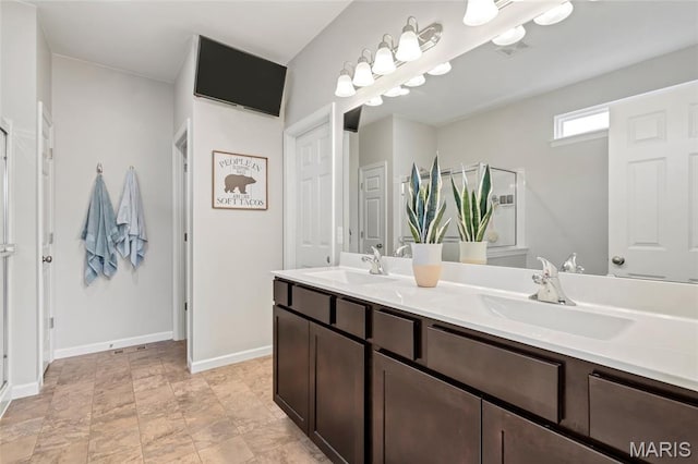 803 Brimley Dr, Cottleville, MO 63304 - bathroom with double vanity and baseboards