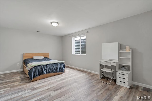 803 Brimley Dr, Cottleville, MO 63304 - bedroom featuring wood finished floors and baseboards