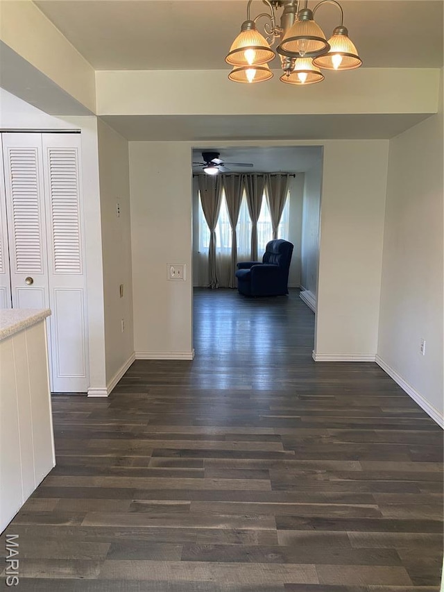 3122 Carnaby Ln Unit C, Bridgeton, MO 63044 - unfurnished dining area with dark wood-style flooring, ceiling fan, and a chandelier