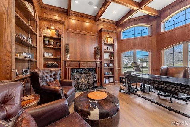 1315 Wildhorse Meadows Dr, Chesterfield, MO 63005 - living room with wooden walls, built in features, an office area, wood finished floors, and beam ceiling
