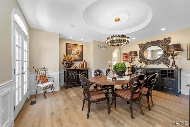 1315 Wildhorse Meadows Dr, Chesterfield, MO 63005 - dining area featuring light wood-style flooring, wainscoting, healthy amount of natural light, a decorative wall, and recessed lighting