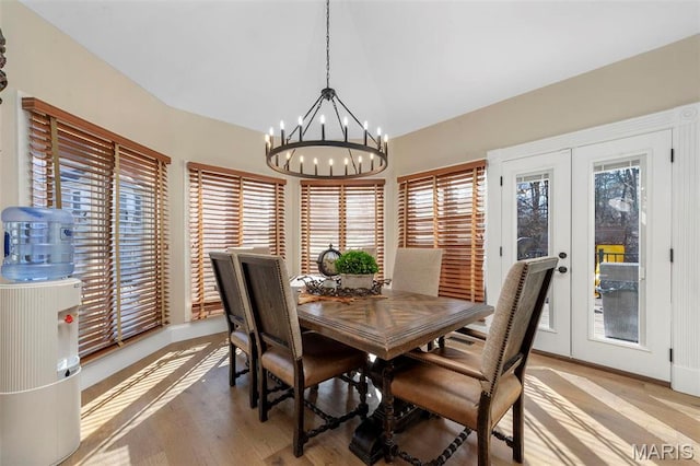 1315 Wildhorse Meadows Dr, Chesterfield, MO 63005 - dining space featuring a chandelier, baseboards, light wood-style floors, and french doors