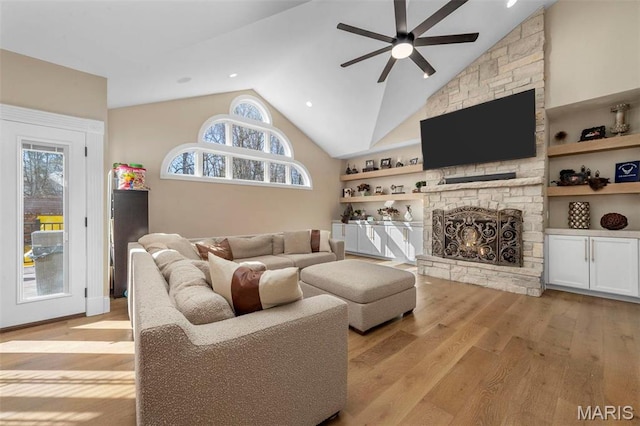 1315 Wildhorse Meadows Dr, Chesterfield, MO 63005 - living room featuring ceiling fan, light wood-style flooring, lofted ceiling, a stone fireplace, and recessed lighting