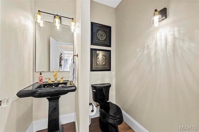 1315 Wildhorse Meadows Dr, Chesterfield, MO 63005 - half bath with baseboards, toilet, and wood finished floors
