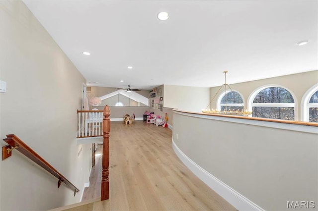1315 Wildhorse Meadows Dr, Chesterfield, MO 63005 - hallway featuring an upstairs landing, light wood-style flooring, recessed lighting, and baseboards