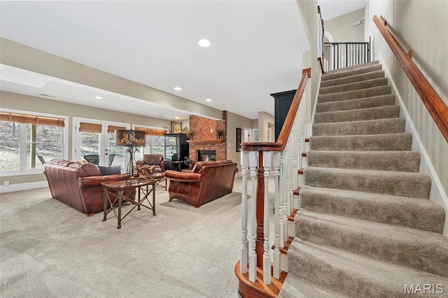 1315 Wildhorse Meadows Dr, Chesterfield, MO 63005 - staircase featuring carpet floors, a brick fireplace, recessed lighting, and baseboards