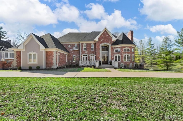 1315 Wildhorse Meadows Dr, Chesterfield, MO 63005 - view of front of property with brick siding, a chimney, and a front yard