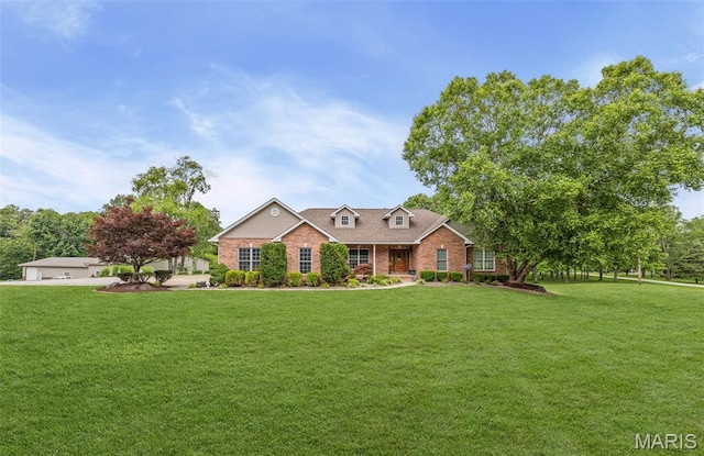 3111 Whispering Pines Dr, Belleville, IL 62221 - view of front facade with a front yard and brick siding