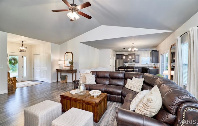 1810 Barclay Bluff Ct, Wentzville, MO 63385 - living area with a chandelier, vaulted ceiling, dark wood-style flooring, and ceiling fan