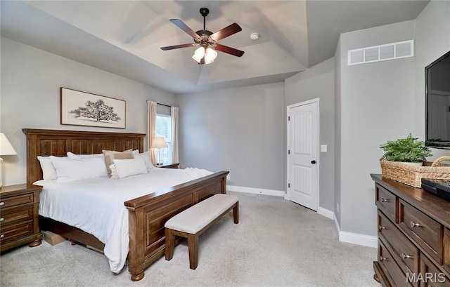 1810 Barclay Bluff Ct, Wentzville, MO 63385 - bedroom featuring a tray ceiling, light carpet, and ceiling fan