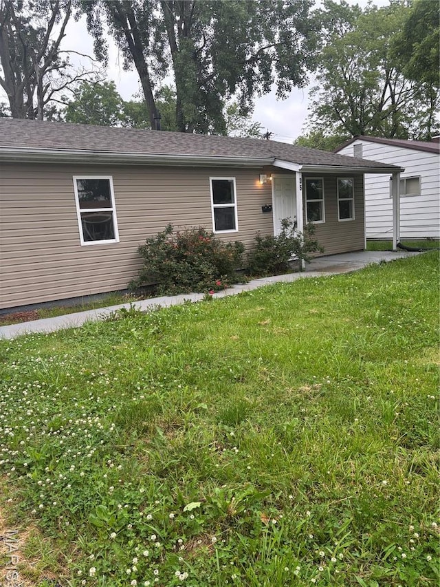 35 Saint Justin Dr E, St Louis, IL 62206 - ranch-style house with a front lawn and a patio