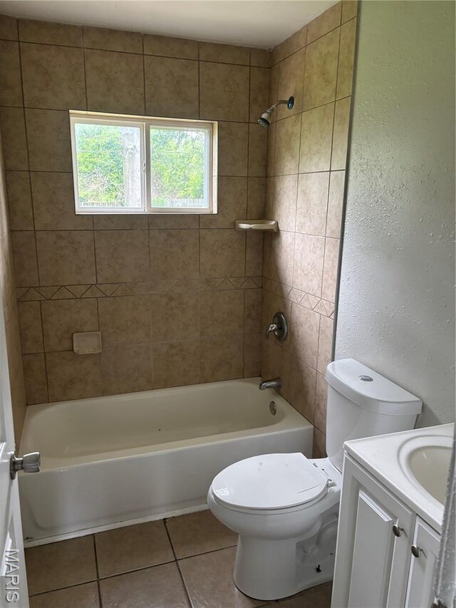 35 Saint Justin Dr E, St Louis, IL 62206 - full bath with tile patterned floors, vanity, toilet, tub / shower combination, and a textured wall