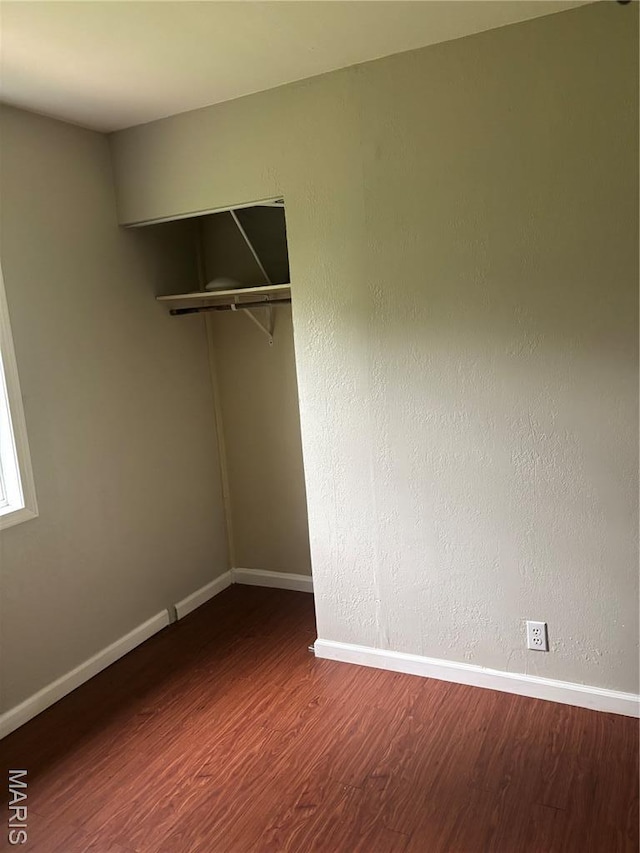 35 Saint Justin Dr E, St Louis, IL 62206 - empty room with wood finished floors and baseboards